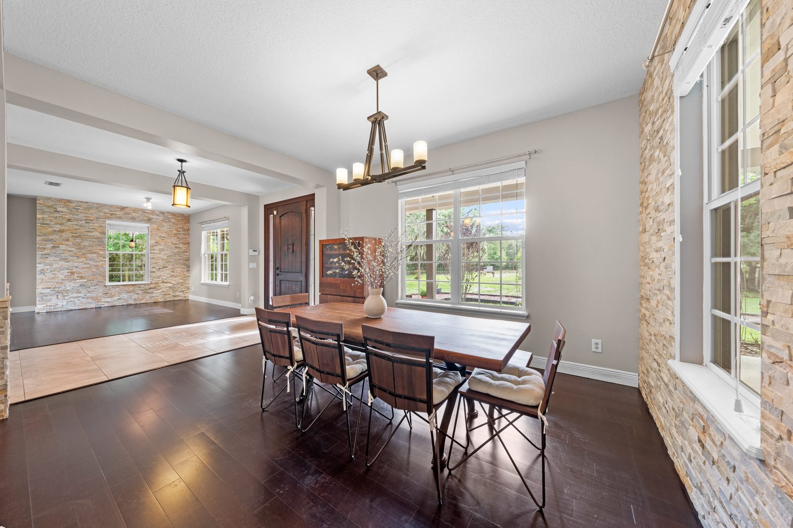 Formal dining room with stacked stone accent