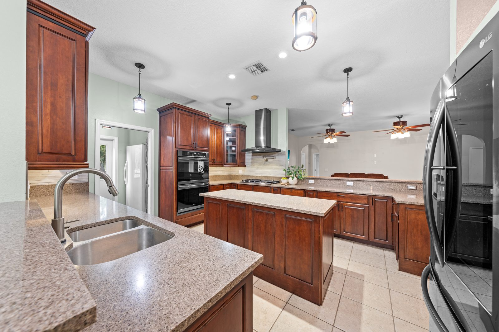 Kitchen with wood cabinetry and oversized island